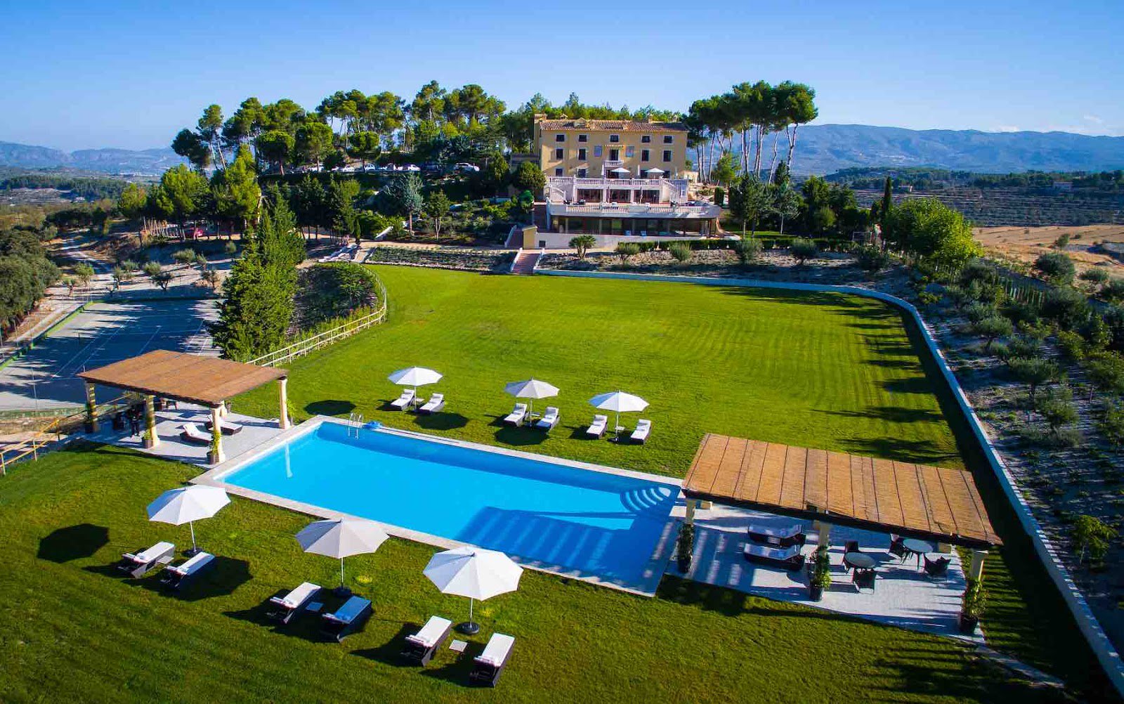 green landscape with the hotel in the background